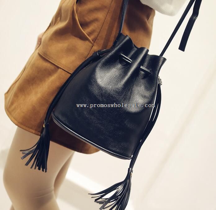 leather tassel draw string travel bag