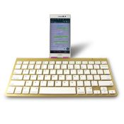 Smal guld färg mini trådlöst Bluetooth-tangentbord images