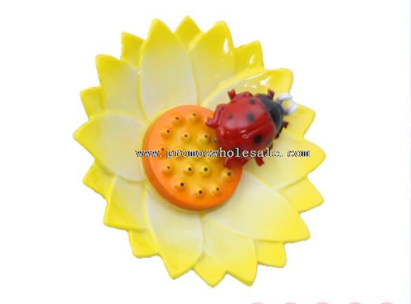 Ladybug fridge magnets with flower pattern