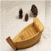 Bamboo ship shaped wooden serving sushi tray images